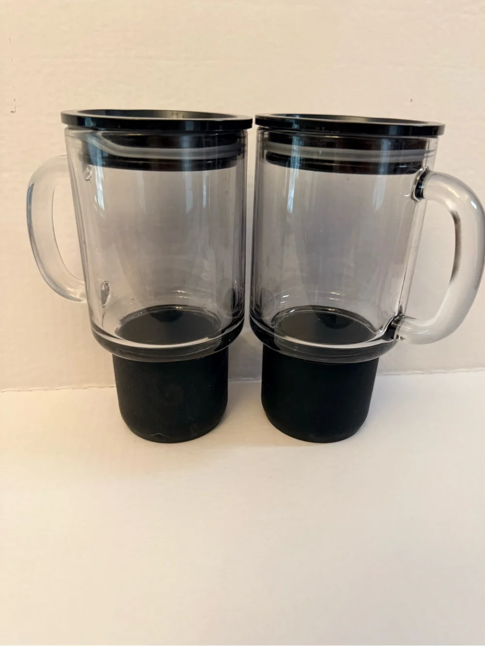 2 Glass tumblers with black silicone base